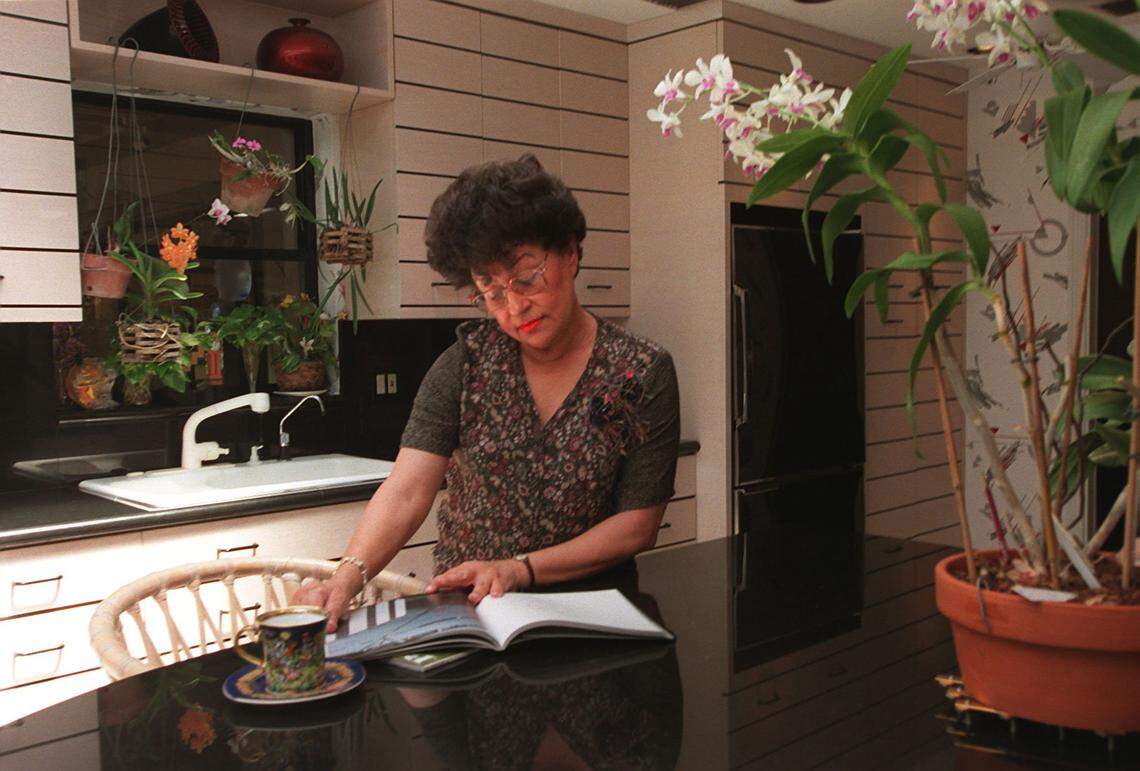 Myrna Palley, in her kitchen in this August 2000 file photo. She, and husband Sheldon, expanded their home twice to accommodate their collection of glass art.