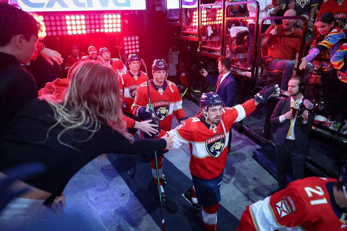 Florida Panthers left wing Ryan Lomberg high fives fans while walking on the ice before the first period of Game 4 of a first round NHL Stanley Cup series against the Boston Bruins at FLA Live Arena on Sunday, April 23, 2023, in Sunrise, Florida.