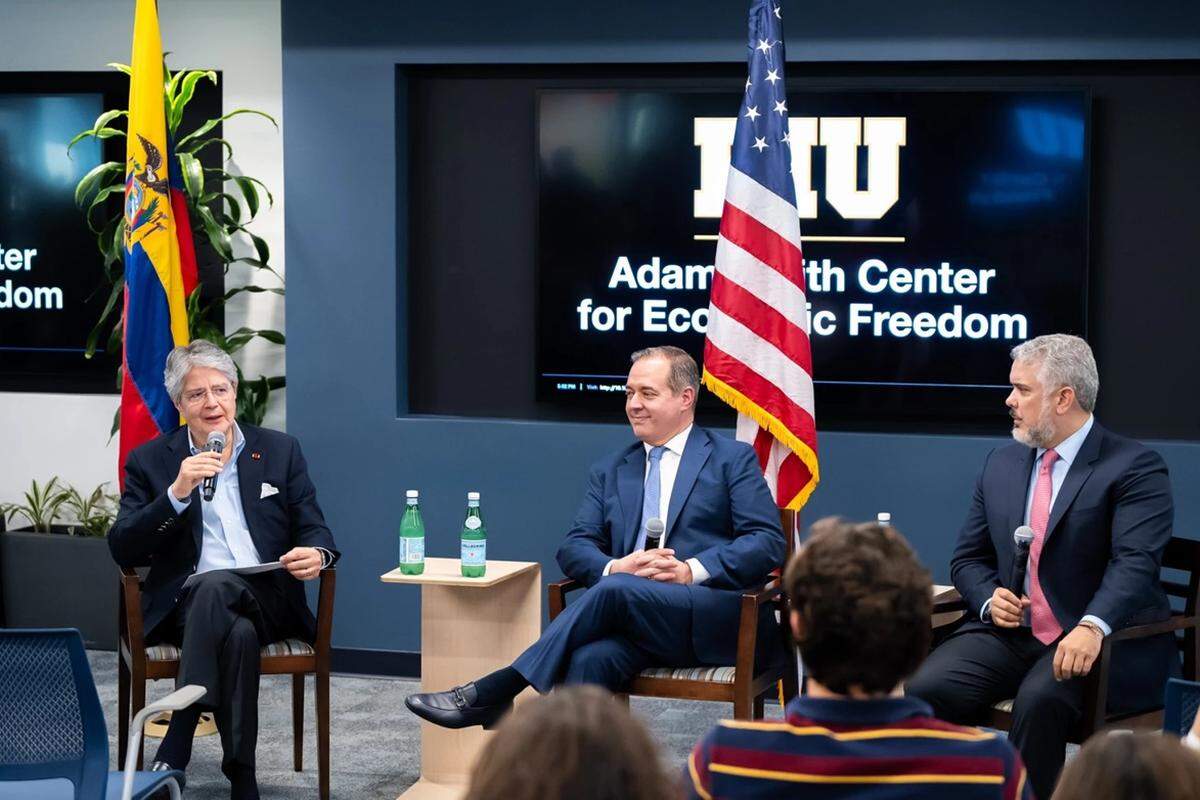 From left, former Ecuadorian President Guillermo Lasso speaks with Adam Smith Center Founding Director Carlos Diaz-Rosillo and former Colombian President Ivan Duque at an event in March 2024.