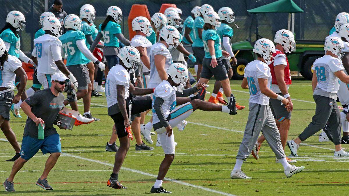 Miami Dolphins players warm-up for practice at their training camp in Davie, Florida, Thursday, December, 5, 2019.