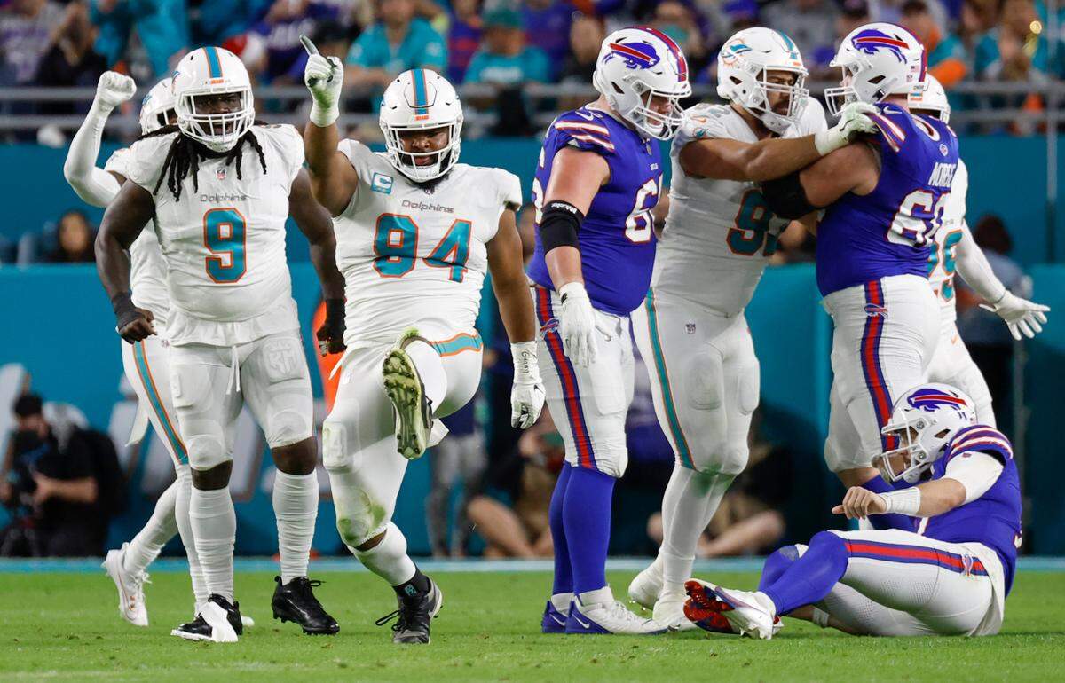 Miami Dolphins defensive tackle Christian Wilkins (94) reacts after sacking Buffalo Bills quarterback Josh Allen (17) in the first quarter at Hard Rock Stadium in Miami Gardens on Sunday, January 7, 2024. 