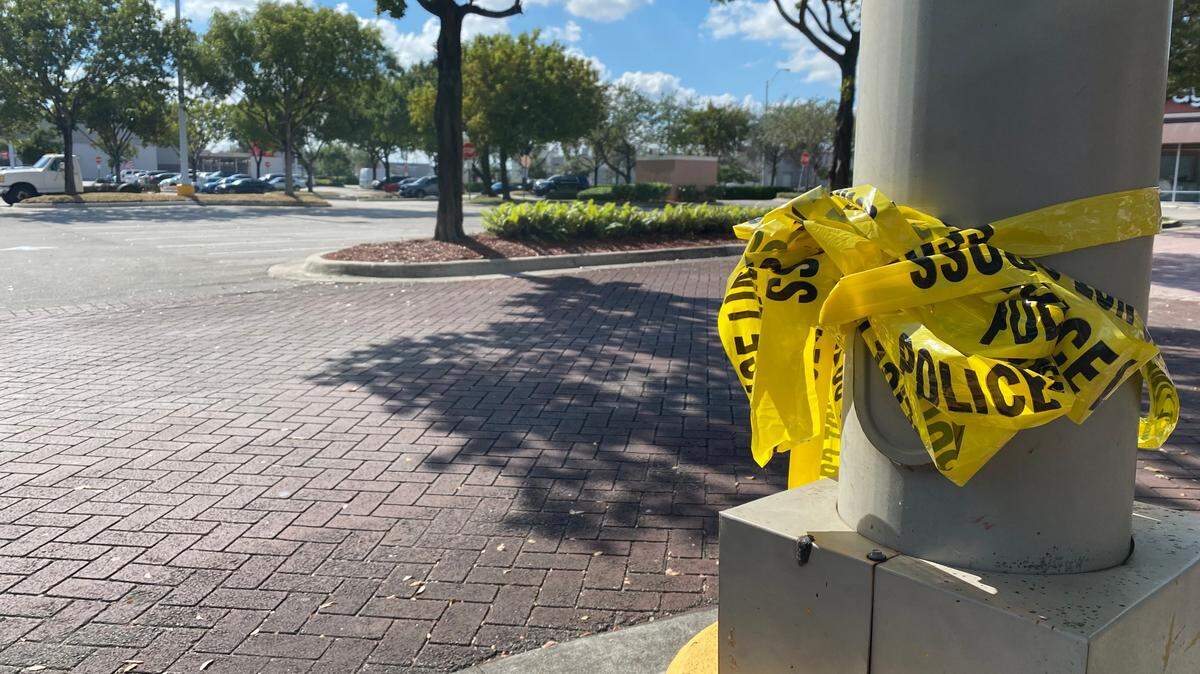 Crime scene tape remained Monday outside the Target in the 1700 block of West 37th Street in Hialeah following a shooting that police blamed on a botched gun deal.