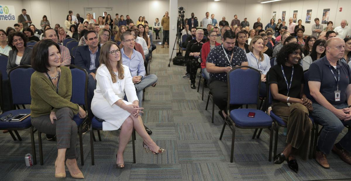 Employees of the Miami Herald and el Nuevo Herald listen to Aminda Marqués González after it was announced at the Doral headquarters that her duties were expanding. She will be both editor and publisher of the Miami Herald Media Company.