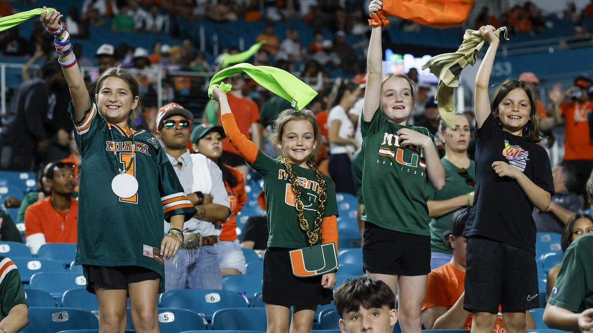 Miami Hurricanes fans show their support in the second half of an NCAA football game against the NC State Wolfpack at Hard Rock Stadium in Miami Gardens, Florida, on Saturday, November 15, 2025.
