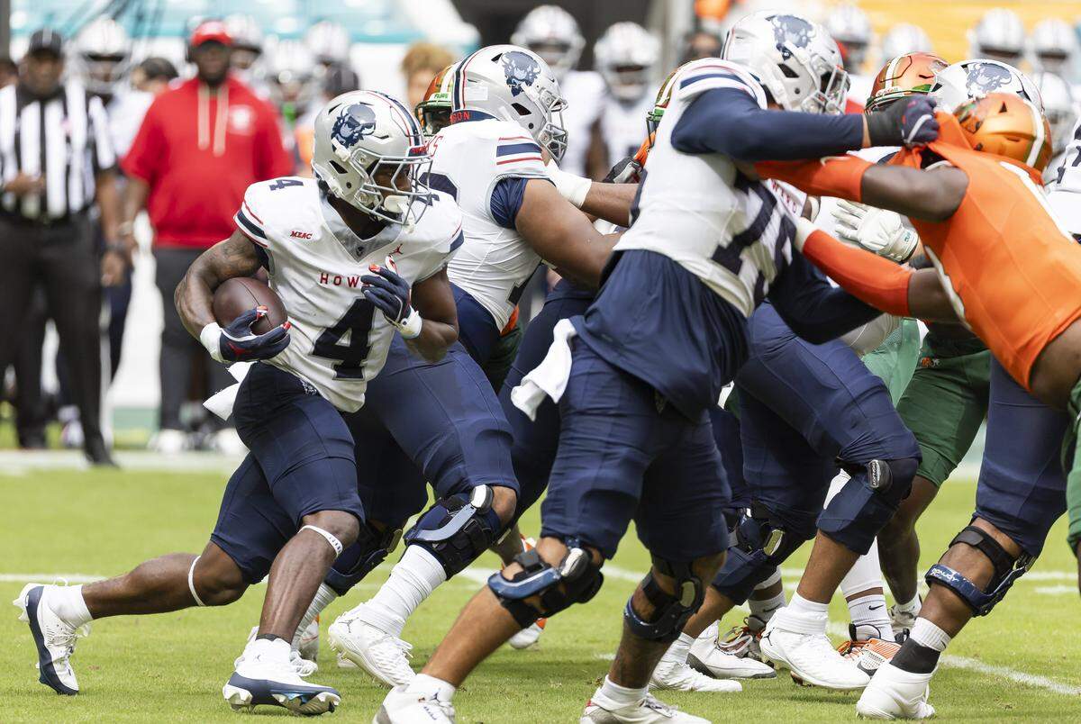 Howard Bison running back Travis Kerney (4) runs with the ball in the first half of his Orange Blossom Classic football game against Florida A&M Rattlers at Hard Rock Stadium on Saturday, Aug. 30, 2025, in Miami Gardens, Fla.