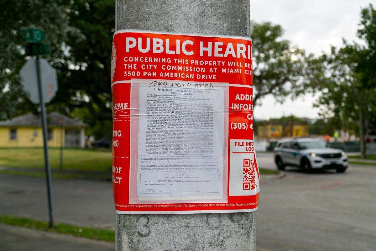 Posters announcing a hearing for a rezoning in Miami’s Highland Park are still up on light posts across the neighborhood.
