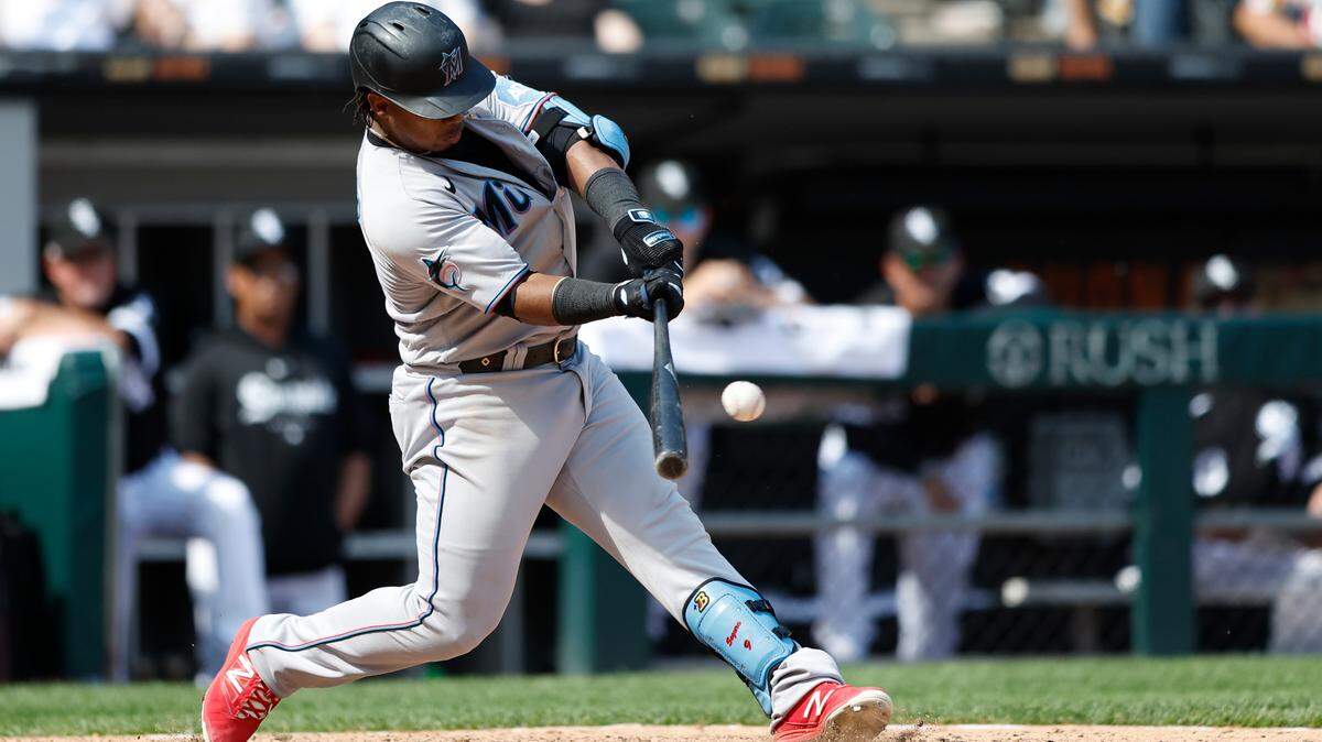 Jun 10, 2023; Chicago, Illinois, USA; Miami Marlins third baseman Jean Segura (9) hits a two-run double against the Chicago White Sox during the ninth inning at Guaranteed Rate Field. Mandatory Credit: Kamil Krzaczynski-USA TODAY Sports