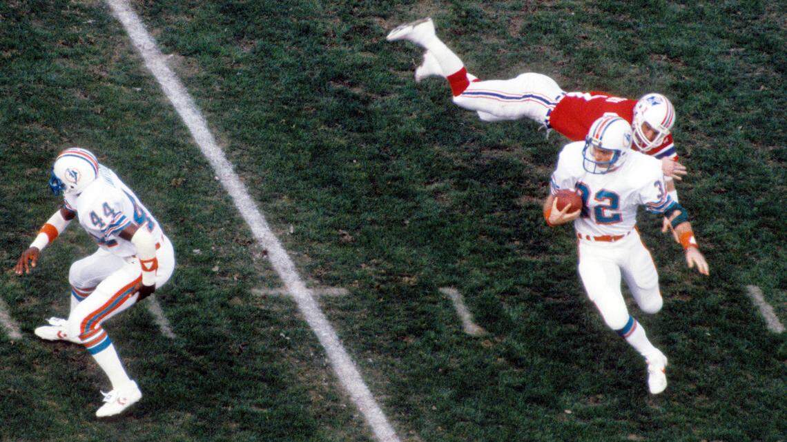 Jan 8, 1983; Miami, FL, USA; FILE PHOTO; Miami Dolphins running back Tommy Vigorito (32) carries the ball against the New England Patriots during the 1982 AFC Wildcard Game at the Orange Bowl. The Dolphins won 28-13. 