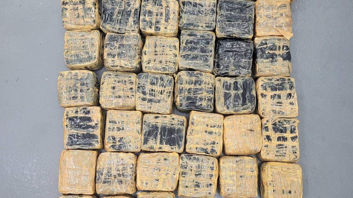 Packages of hashish are displayed on a table. The drugs were found floating at sea off Key West by a boater Saturday, Sept. 9, 2023, according to the U.S. Border Patrol.
