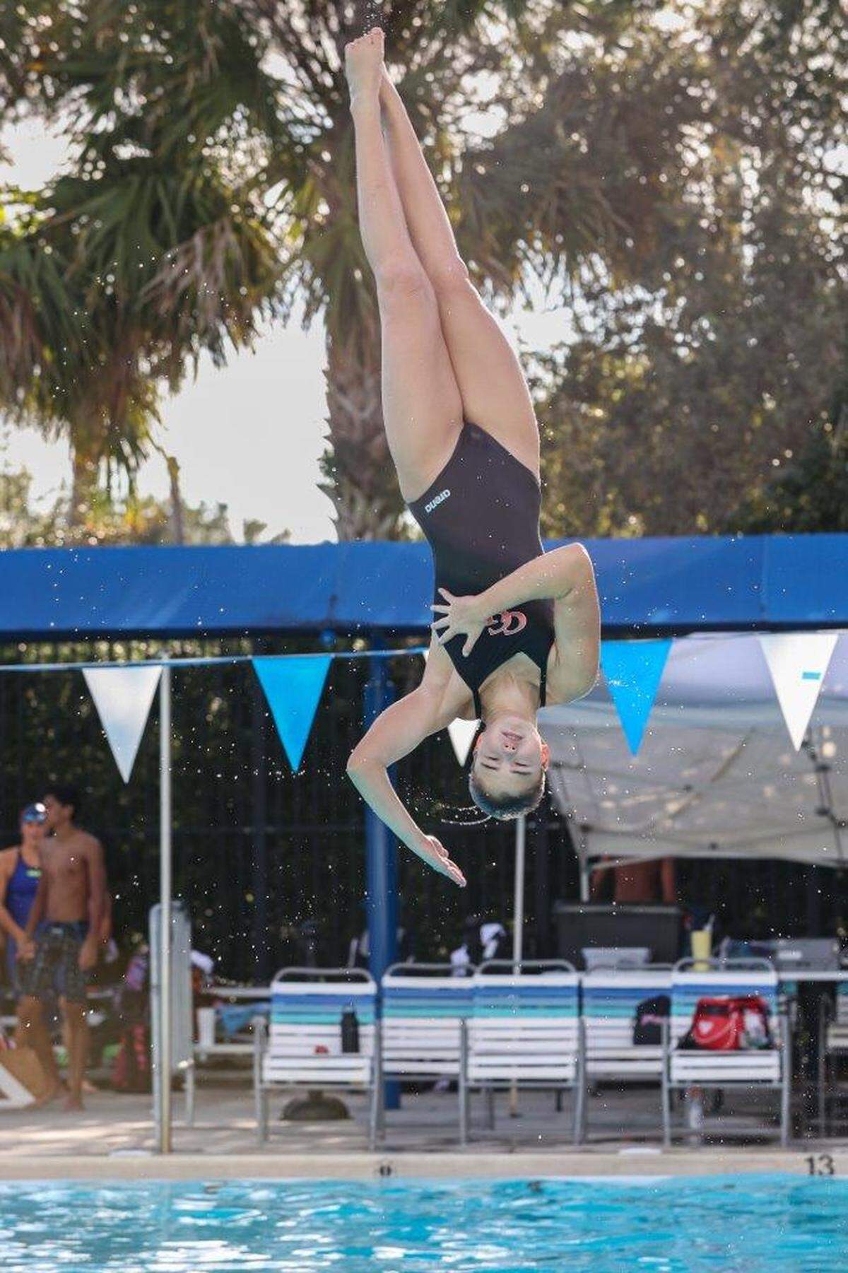 Cardinal Gibbons diver Juliet Radich, seen here in mid-dive, broke the state’s 1-meter springboard diving record at the Region 4-2A meet with a final score 544.25.