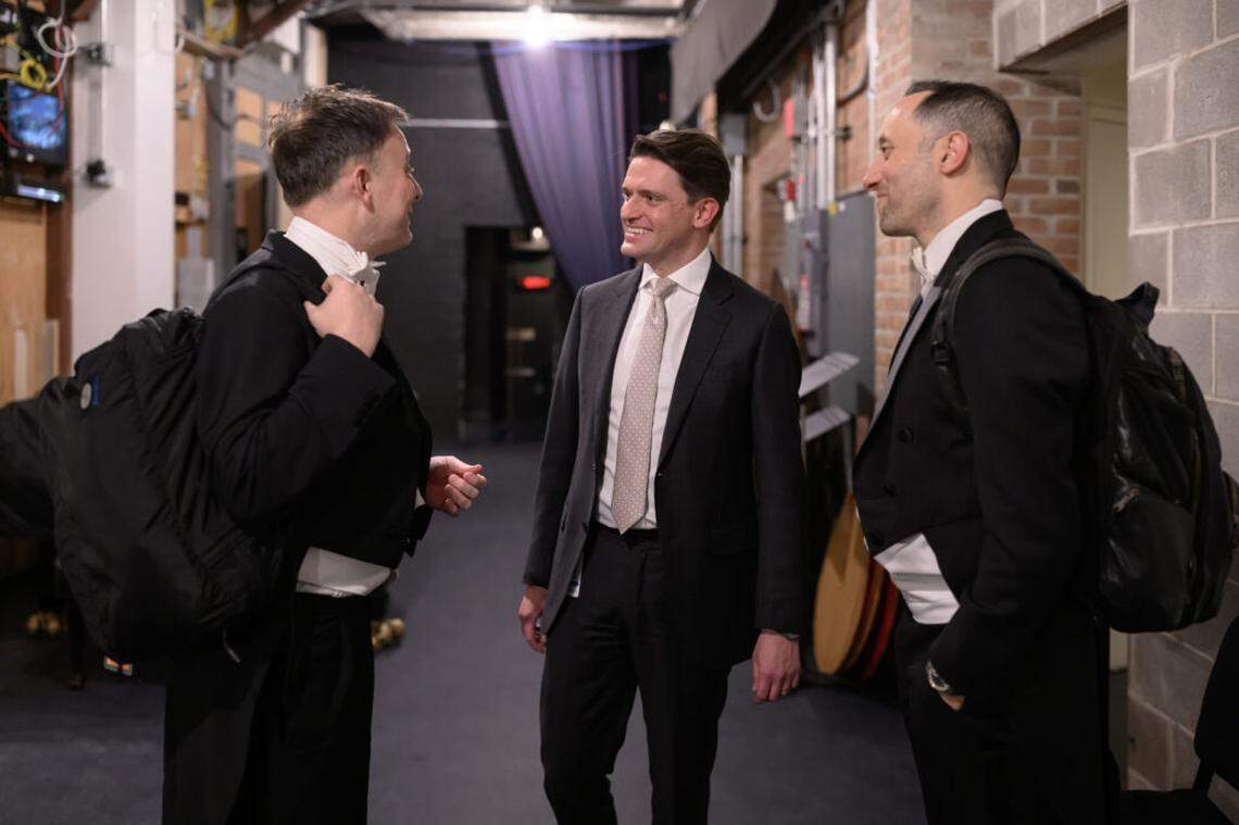 “We don’t treat Miami as a tour destination,” says Ilya Gidalevich, vice president of artistic planning for The Cleveland Orchestra. shown at center. “We really see it as a second home.” Clarinetist Robert Woolfrey is at left, and principal oboist Frank Rosenwein, right, during rehearsals for Verdi’s “Requiem.”