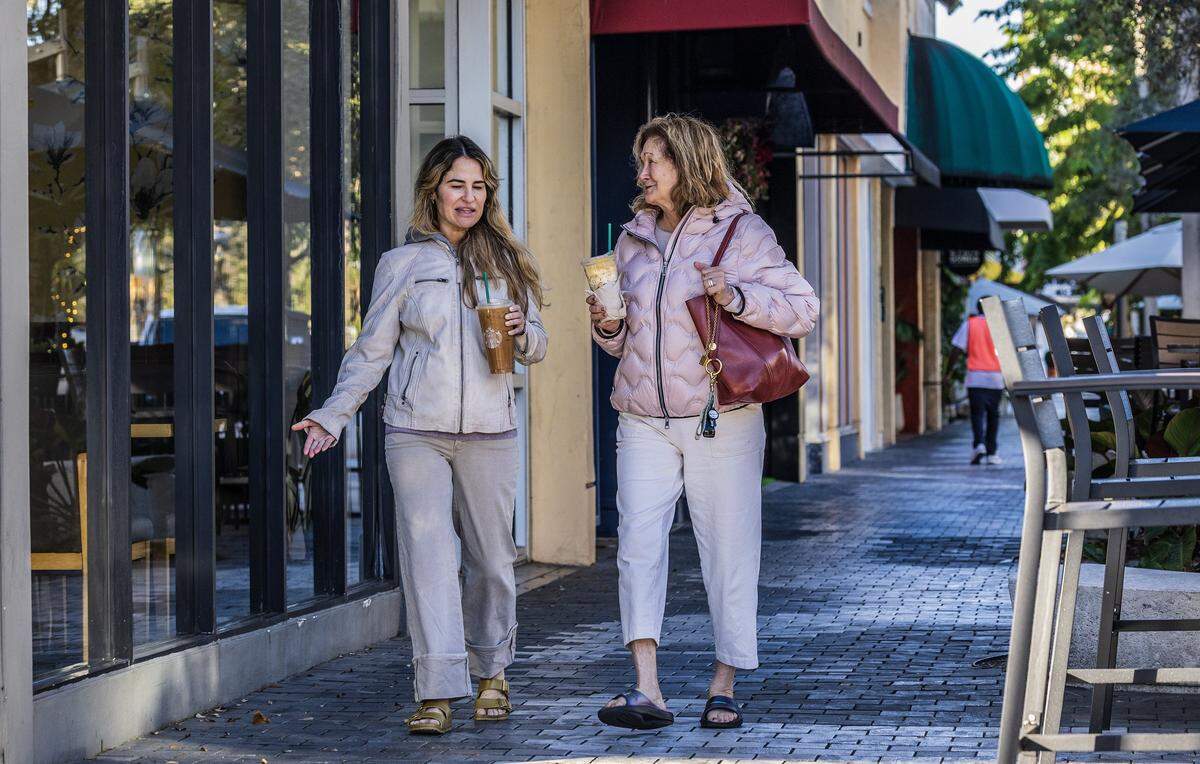 The cold temperatures didn't stop Allison (left) and Cynthia Trescott from taking a coffee walk along Miracle Mile in Coral Gables, as Miami woke to one of its coldest New Year's Eves in decades, on Wednesday, December 31, 2025. 