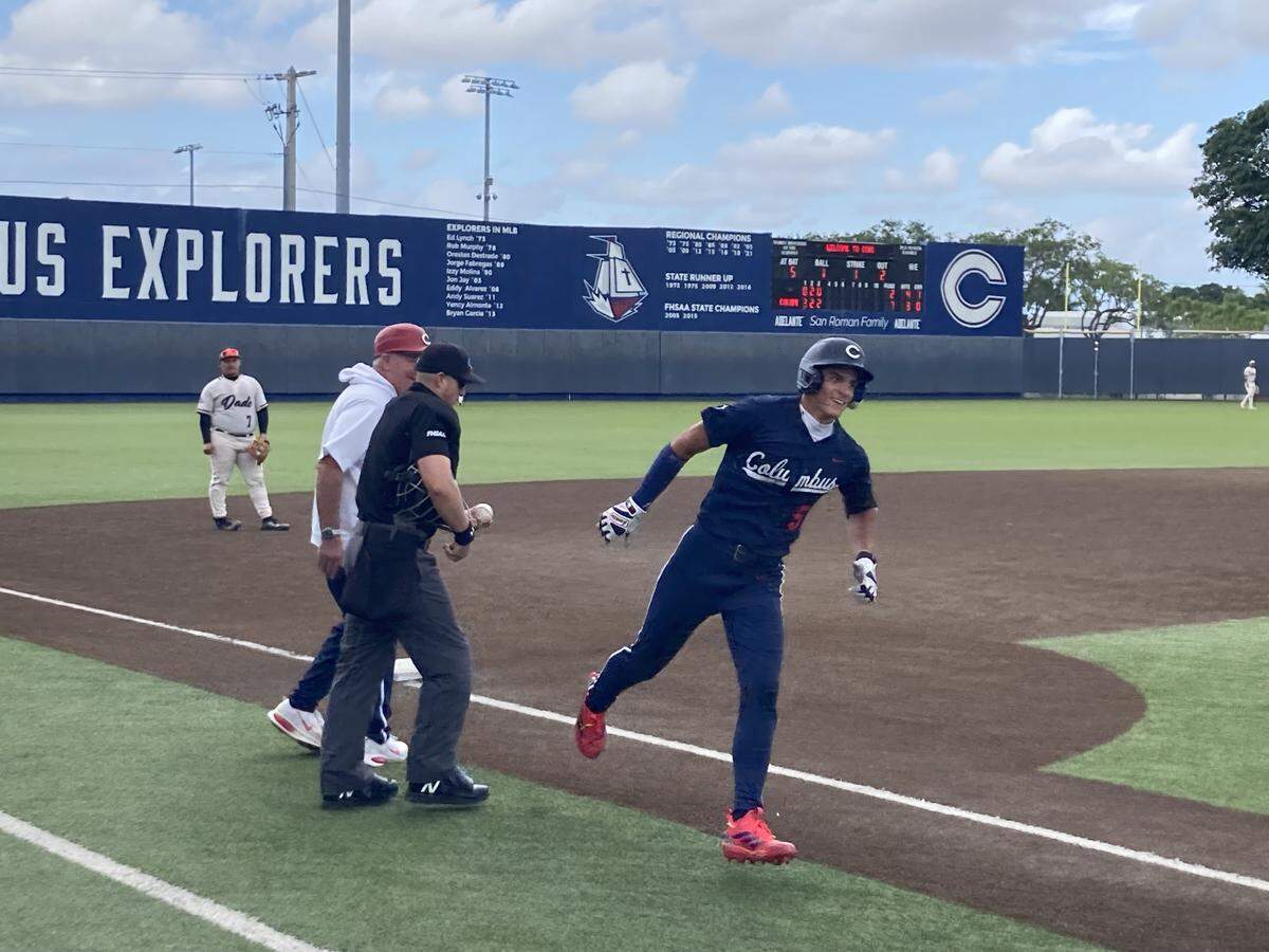 Columbus’ A.J. Rivero is congratulated as he rounds third following after his two run homer over the wall in left center in the third inning of Friday’s Region 4-7A quarterfinal at Columbus High.
