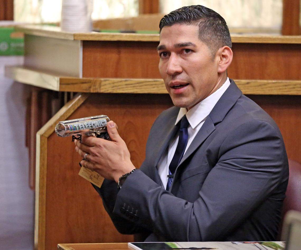 Taking the witness stand Wednesday in his own defense, North Miami Police officer Jonathon Aledda holds a toy truck that he says he mistook for a handgun before he shot an autistic man who was holding the truck.