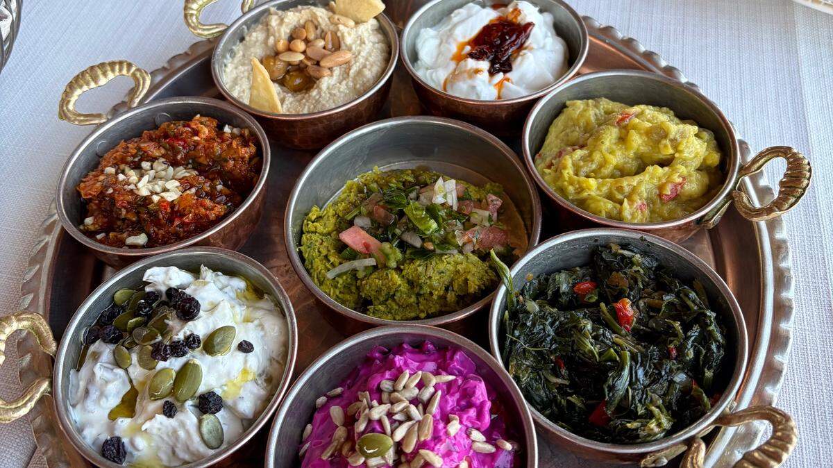 A mezze platter in Istanbul. Mezze is a grouping of small hot or cold dishes that are served together at the table for a meal. It’s a common Turkish and Middle Eastern custom.