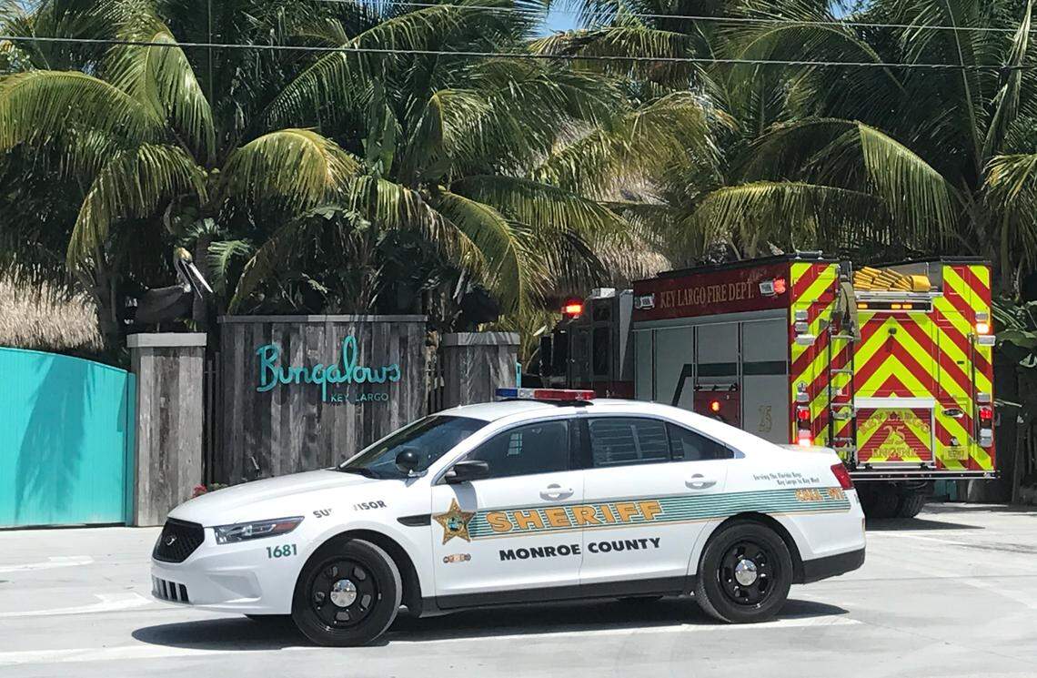 A Monroe County Sheriff’s Office car is parked at the entrance of Bungalows Key Largo Monday, May 6, as a Key Largo Volunteer Fire Department truck enters the property. A fire destroyed the main building at the hotel Sunday, May 5. David Goodhue/dgoodhue@flkeysnews.com