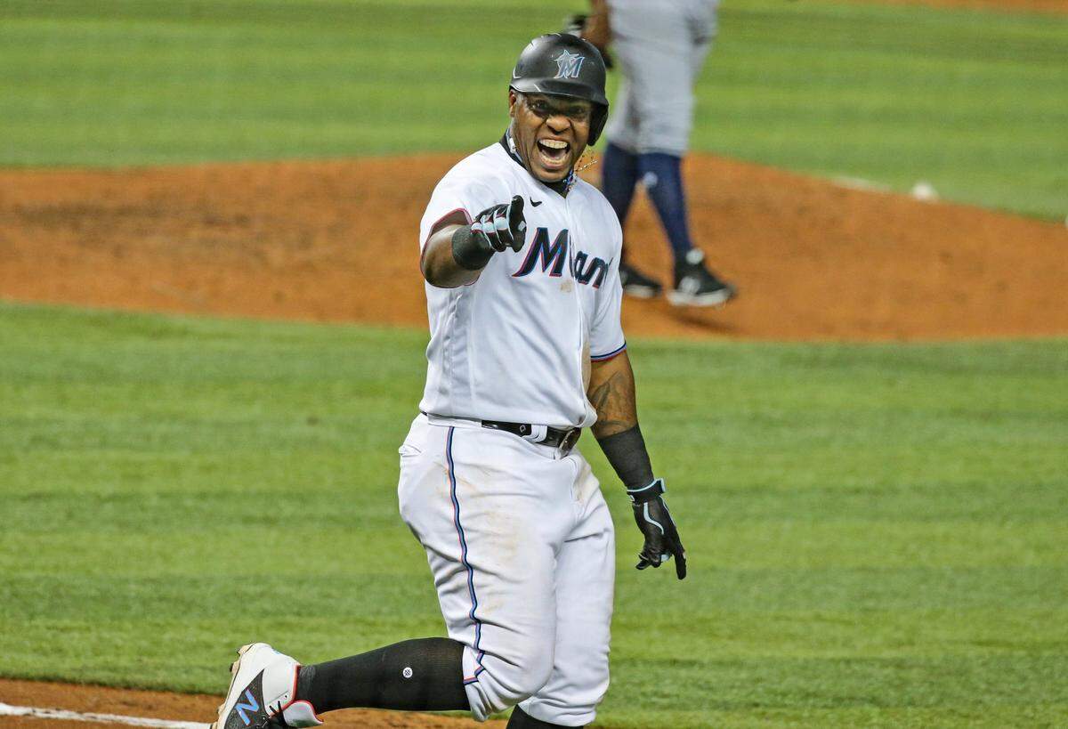 Miami Marlins first baseman Jesus Aguilar (24) reacts after hitting the ball to the outfield wall but short of a homer in the 9th inning against the Tampa Bay Rays at loanDepot park in Miami on Thursday, April 1, 2021.