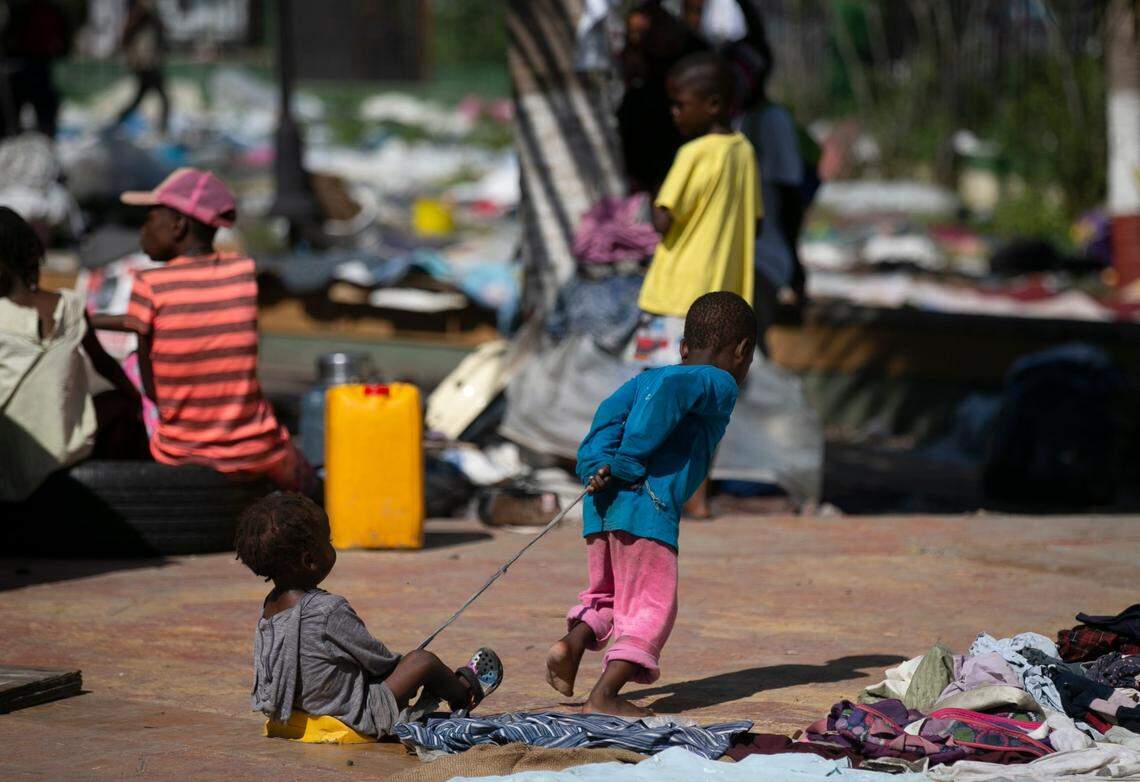 A child playfully pulls another child with a rope at the Hugo Chávez public square, which has been transformed into a refuge for families forced to leave their homes due to clashes between armed gangs in Port-au-Prince, Haiti, Thursday, Oct. 20, 2022.