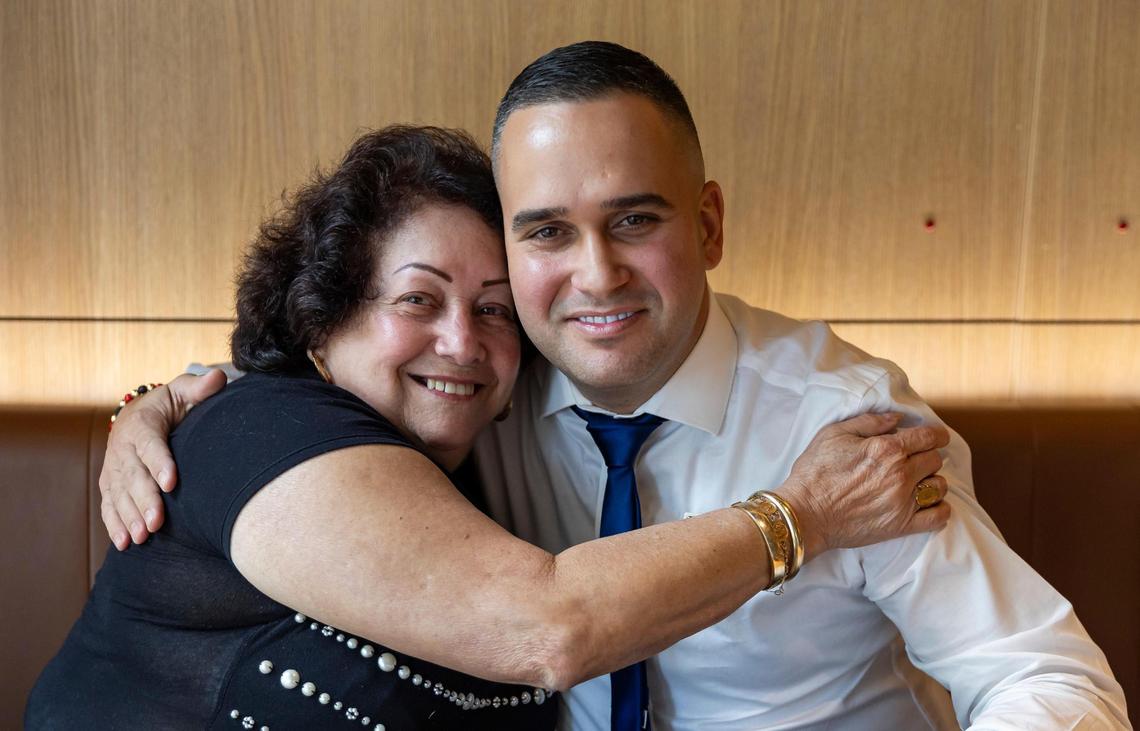 Marcial Hernandez Arias, general manager of a Miramar McDonald’s, is shown with his grandmother, Marisela Herrero. She brought Arias to Miami from rural Cuba in 2007. He’s now one of the top managers working for the global fast-food chain.