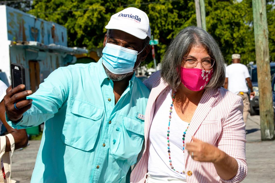 County Mayor-elect Daniella Levine Cava takes a selfie with Cuthbert “Broadway” Harewood Jr. near a mural designed in her honor, as she stops in the Liberty City neighborhood of Miami on a tour of Miami-Dade on Sunday, Nov. 15, 2020. Levine Cava becomes Miami-Dade’s first woman mayor on Tuesday, Nov. 17.