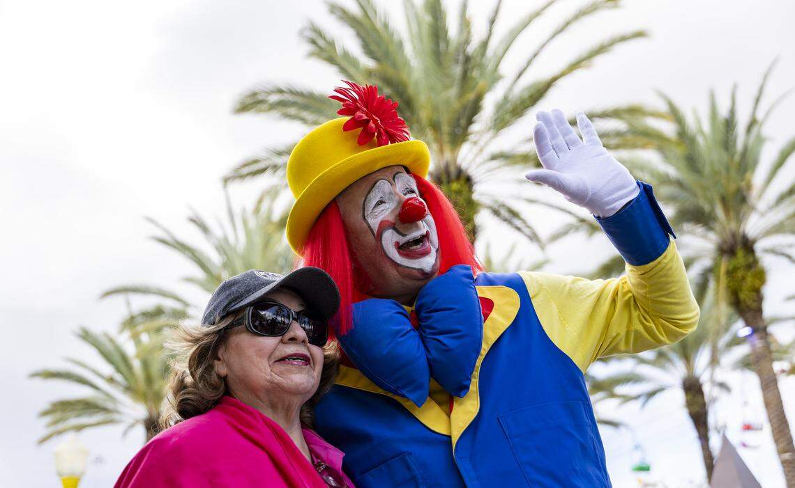 Eliette Navarro, 70, takes a photo with Tadpole as she attends the opening day of the 74th annual Miami-Dade County Youth Fair on Thursday, March 12, 2026, in Miami, Fla.