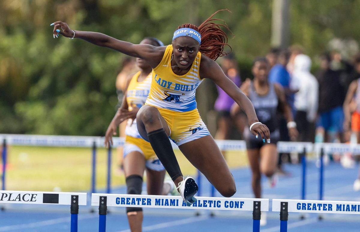 Shakynah Tresvant, from Miami Northwestern Senior High, competes in the girls 400 meter hurdles during the GMAC track and field championships at the Traz Powell Stadium on Thursday, April 11, 2024, in Miami, Fla.
