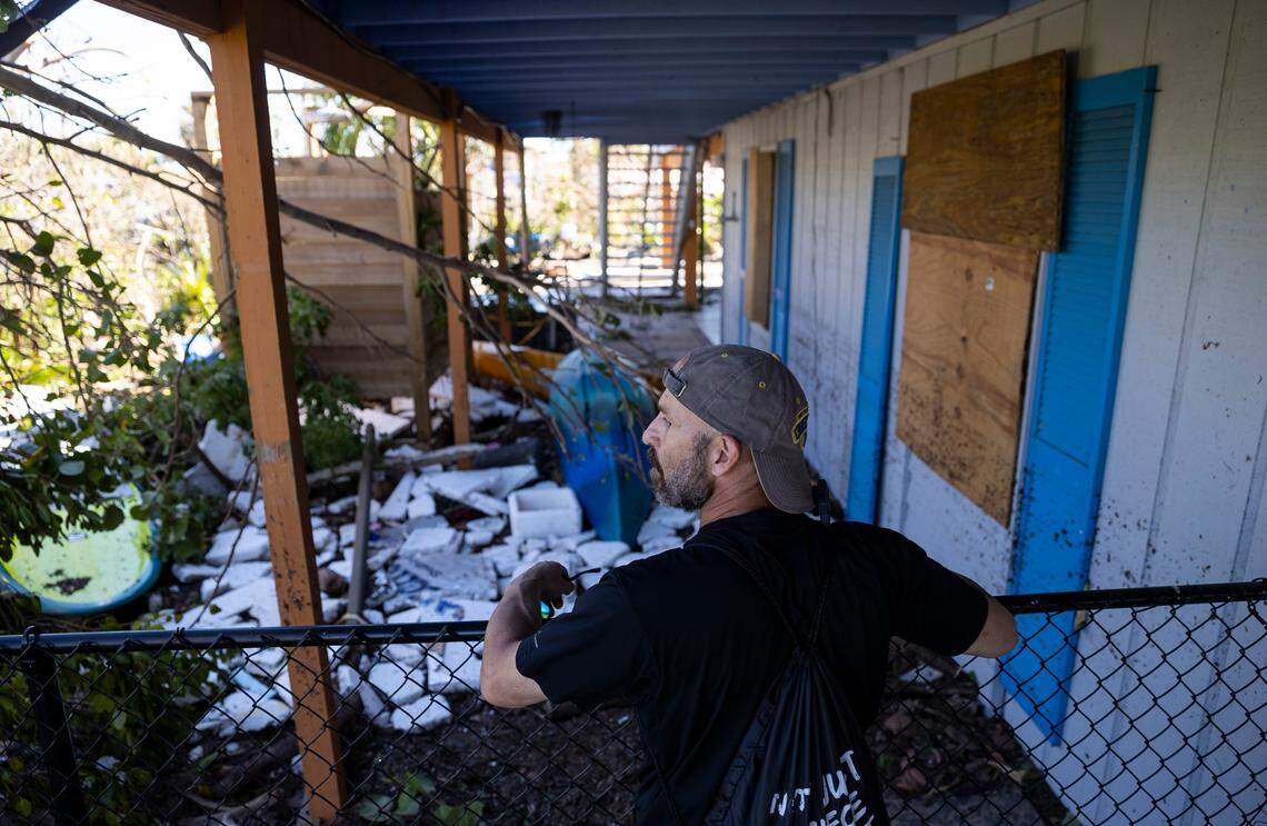 Mike Romeo, 53, surveys damage at his St. James City home on Friday, Sept. 30, 2022, in Pine Island, Florida. Romeo has lived on Pine Island for years. Hurricane Ian made landfall on the coast of Southwest Florida as a Category 4 storm on Sept. 28.