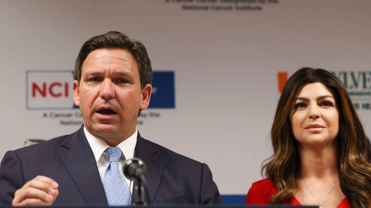 Gov. Ron DeSantis speaks during a press conference while accompanied by First Lady Casey DeSantis on Tuesday, May 17, 2022, at the Don Soffer Clinical Research Center in Miami.