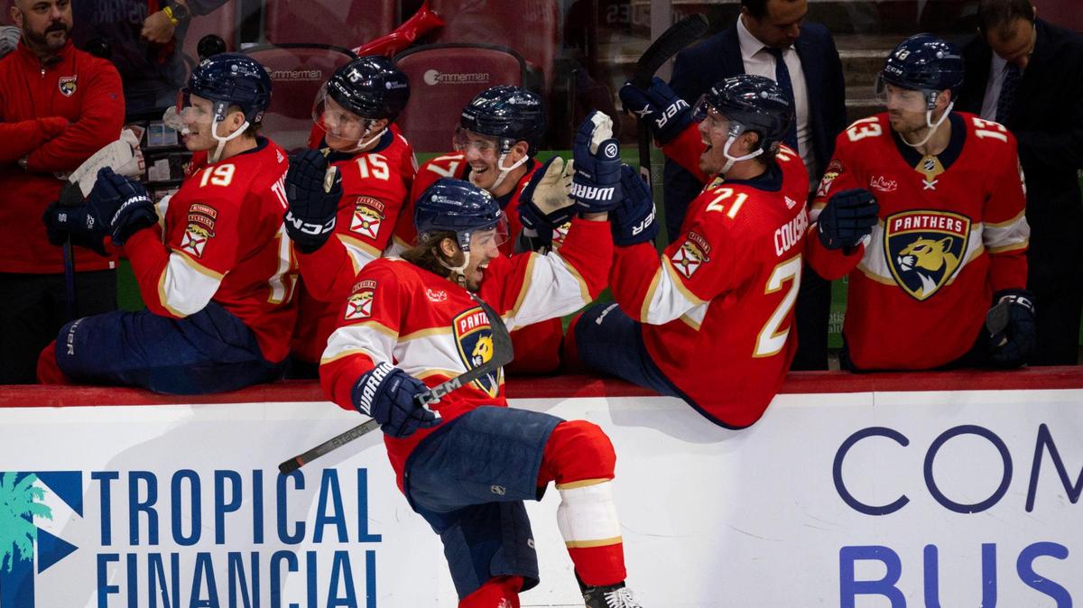 Florida Panthers left wing Ryan Lomberg (94) high fives teammates after a goal during the third period of a hockey game on Thursday, Feb. 8, 2024, at Amerant Bank Arena in Sunrise, Fla. The Panthers won 4-2.