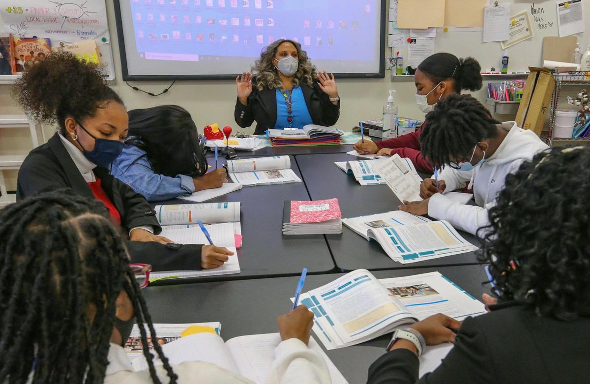 Norland Senior High School teacher Renee O’Connor speaks with students in her classroom on Jan. 26, 2022. O’Connor is one of four finalists for Miami-Dade County Teacher of the Year.