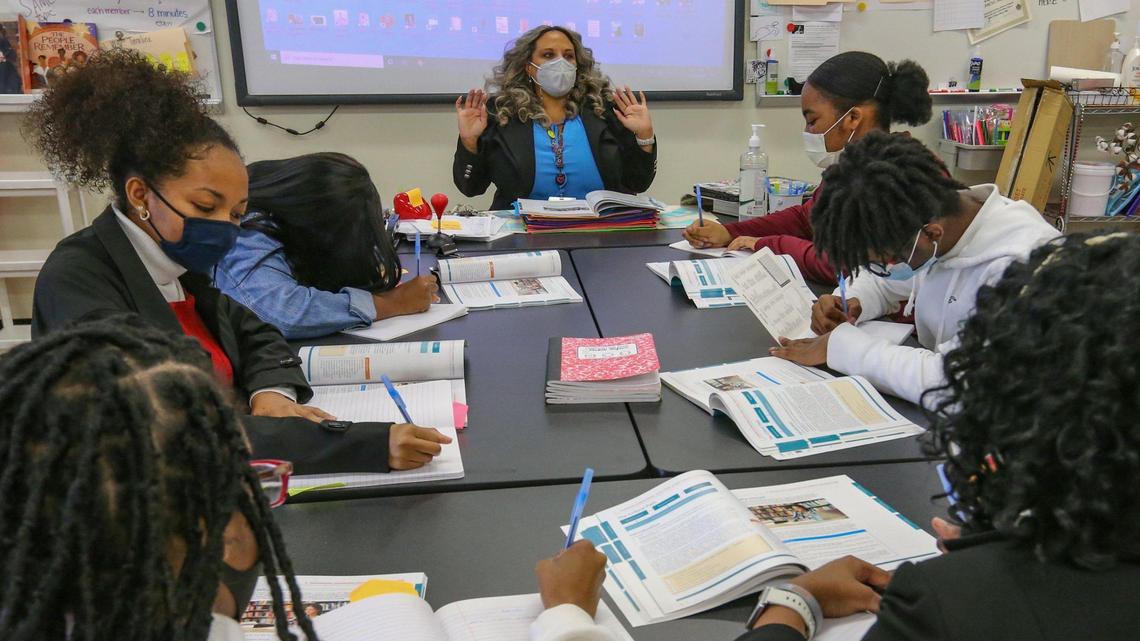 Norland Senior High School teacher Renee O’Connor speaks with students in her classroom on Wednesday, January 26, 2022.