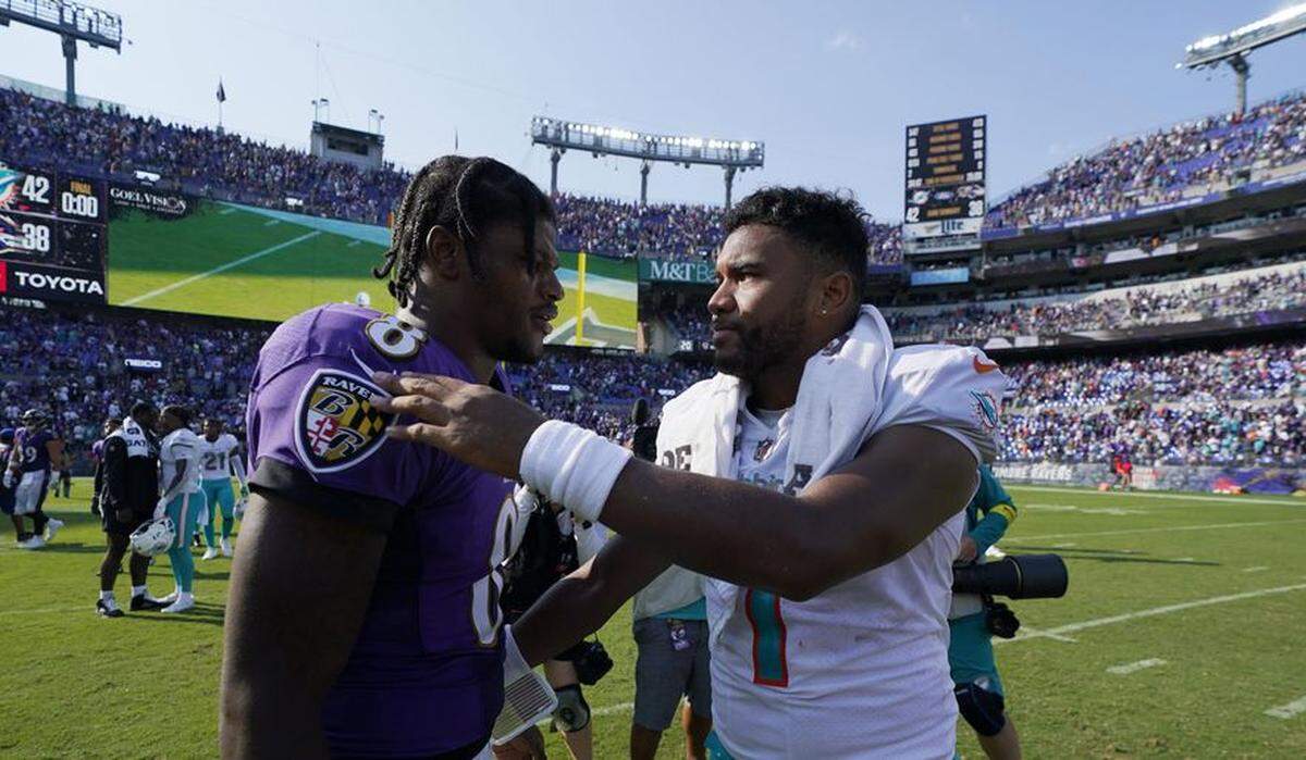 Ravens quarterback Lamar Jackson (left) and Dolphins QB Tua Tagovailoa (right) meet on the field after Miami’s 42-38 NFL victory in Baltimore on September 18, 2022.