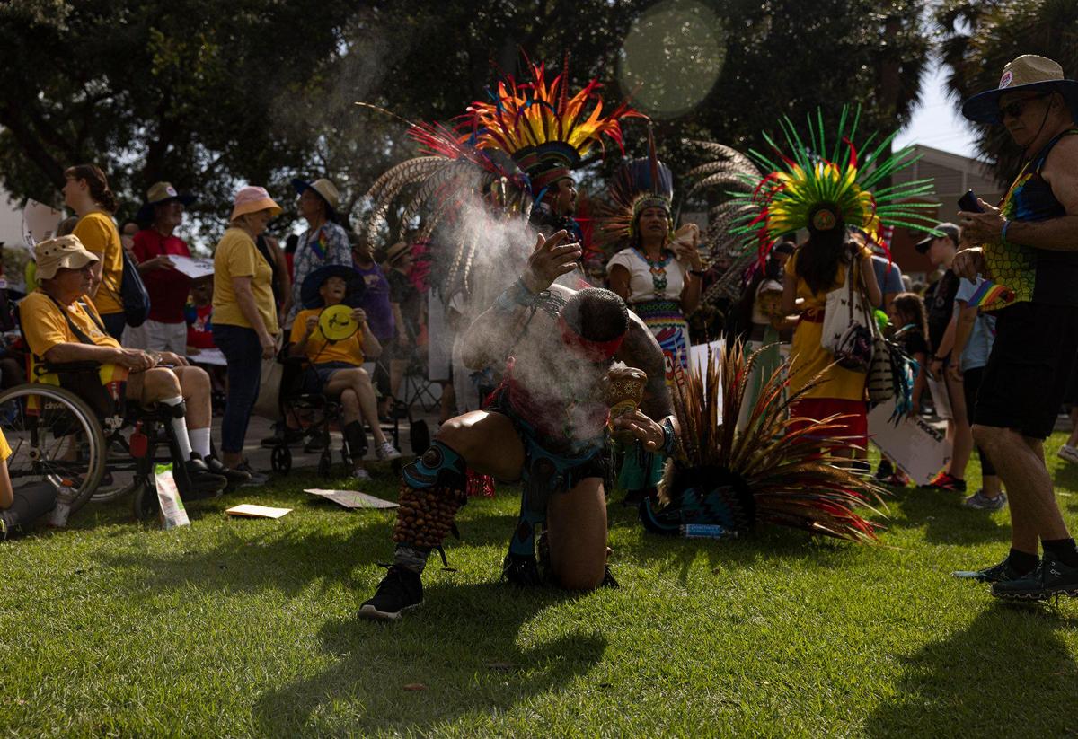 Alberto Reyes performs a blessing with coapl, an incense-like substance, during an Anti-Hate March led by We the People on Sunday, July 2, 2023, in downtown Fort Lauderdale. Coapl what this indigenous group, Tonalxochitl, uses to protect themselves and send prayers to universe.