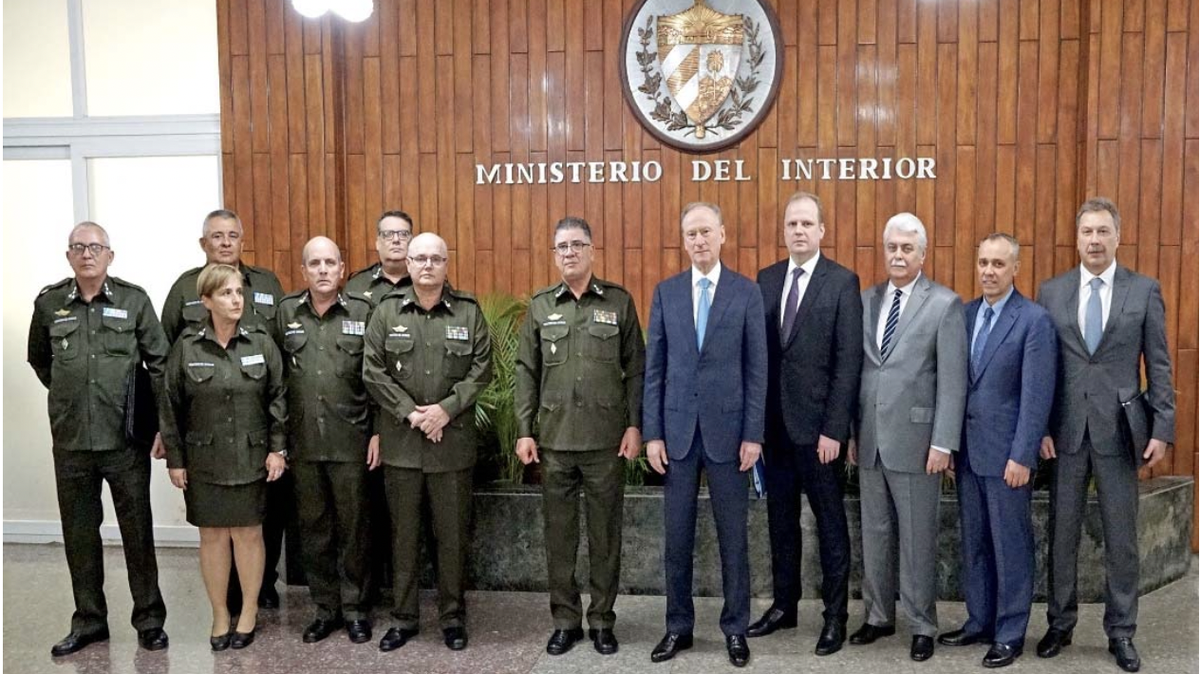 General Nikolai Patrushev, the Russian Security Council secretary, and Cuban Ministry of Interior’s top chief, division general Lázaro Alberto Álvarez Casas (center), during a meeting at the ministry’s headquarters in Havana, Cuba, early March, 2023.