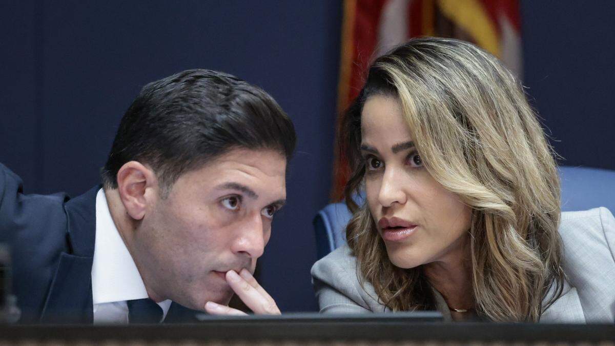 Miami-Dade Comissioners Roberto J. Gonzalez and Danielle Cohen Higgins have a discussion during Miami-Dade Mayor Daniella Levine Cava's 2026 budget proposal meeting at the Stephen P. Clark Government Center in Miami on Thursday, Sept. 4, 2025. 