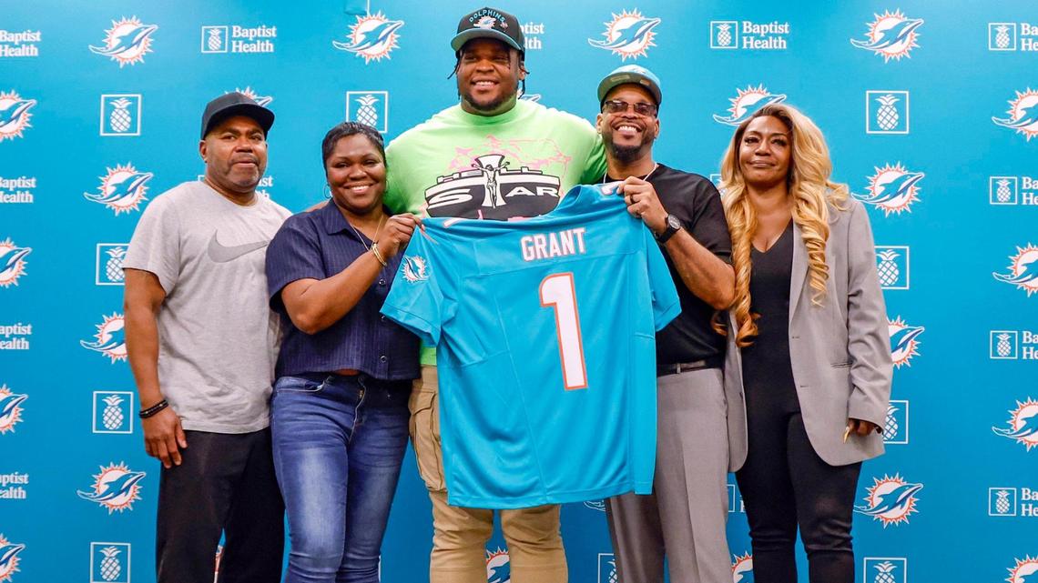 Dolphins 13th overall draft pick, Michigan defensive tackle Kenneth Grant, poses with his family during a press conference in Miami Gardens on Friday.