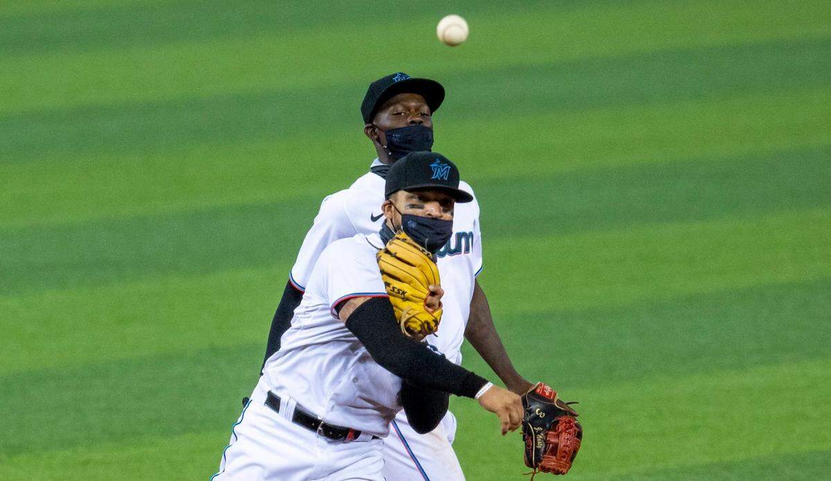 Miami Marlins infeidler Isan Diaz (1) throws to first base after getting Phillies outfielder Kyle Garlick (23) out at second to complete the double play during the sixth inning of the first game of a double header against the Philadelphia Phillies at Marlins Park in Miami, Florida on Sunday, September 13, 2020.