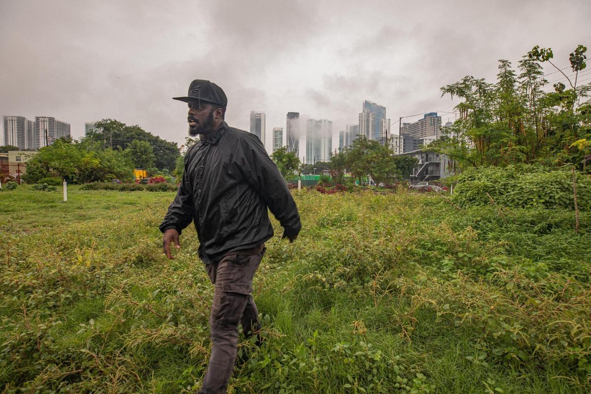 President of the Green Haven Project David Roper walks through the garden at the Green Haven Project in Miami.