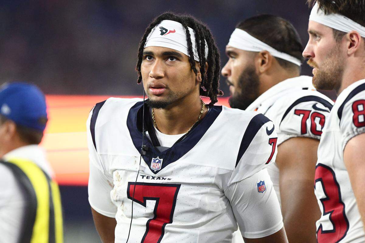 Aug 10, 2023; Foxborough, Massachusetts, USA; Houston Texans quarterback C.J. Stroud (7) watches the game from sidelines during the second half of a game against the New England Patriots at Gillette Stadium. Mandatory Credit: Brian Fluharty-USA TODAY Sports