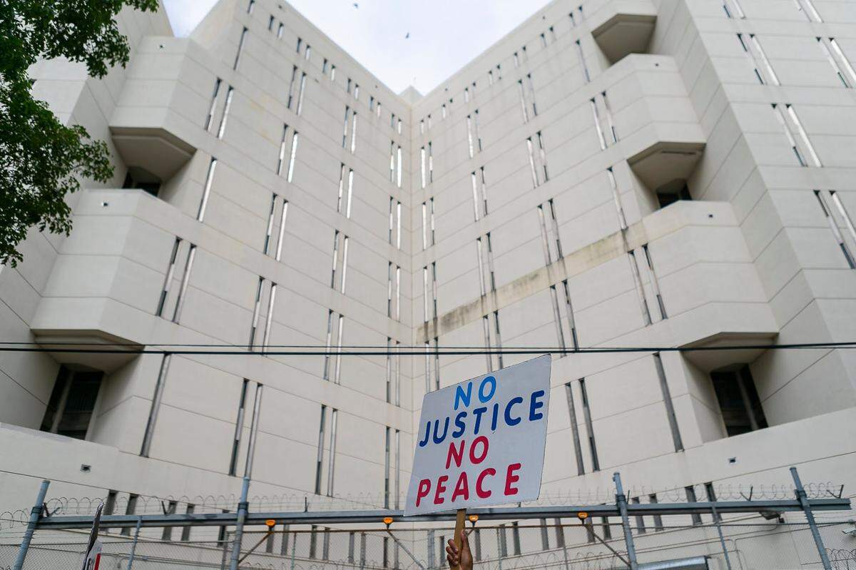 Activists gather outside of the Broward County Jail during a Defund The Police Juneteenth Rally in Fort Lauderdale, Florida on Friday, June 19, 2020.