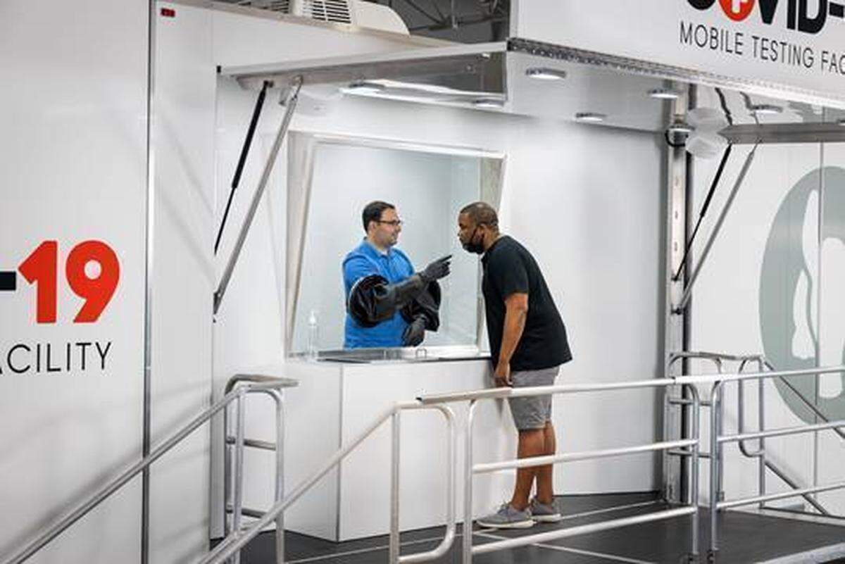 The Aardvark Mobile Health trucks have a glass pane to separate the nurse from the person being tested.