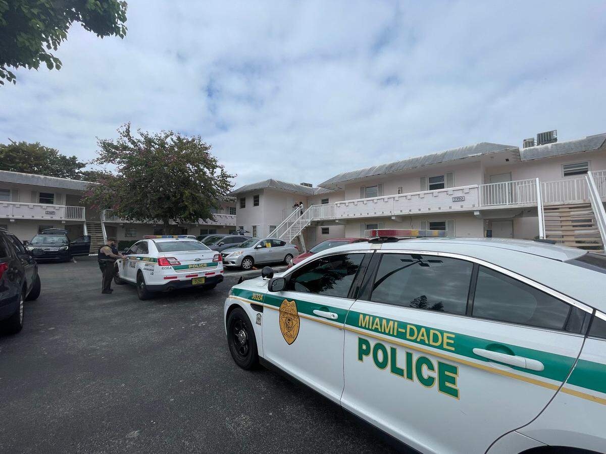 Miami-Dade police investigate a shooting that happened early Friday morning, Feb. 9, 2024, in the parking lot of the Village at Dadeland condo complex.
