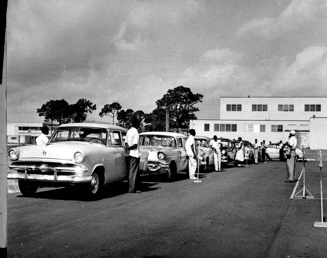 Driving safety class at .Northwestern High puts 300 student drivers through the paces in 1958.