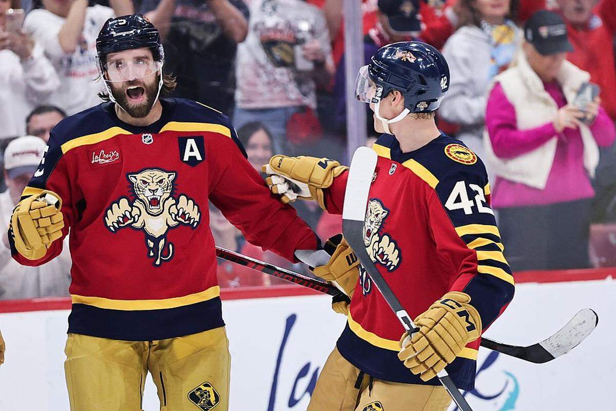 SUNRISE, FLORIDA - JANUARY 04: Aaron Ekblad #5 of the Florida Panthers celebrates his goal with Gustav Forsling #42 against the Colorado Avalanche during the second period at Amerant Bank Arena on January 04, 2026 in Sunrise, Florida. (Photo by Carmen Mandato/Getty Images)