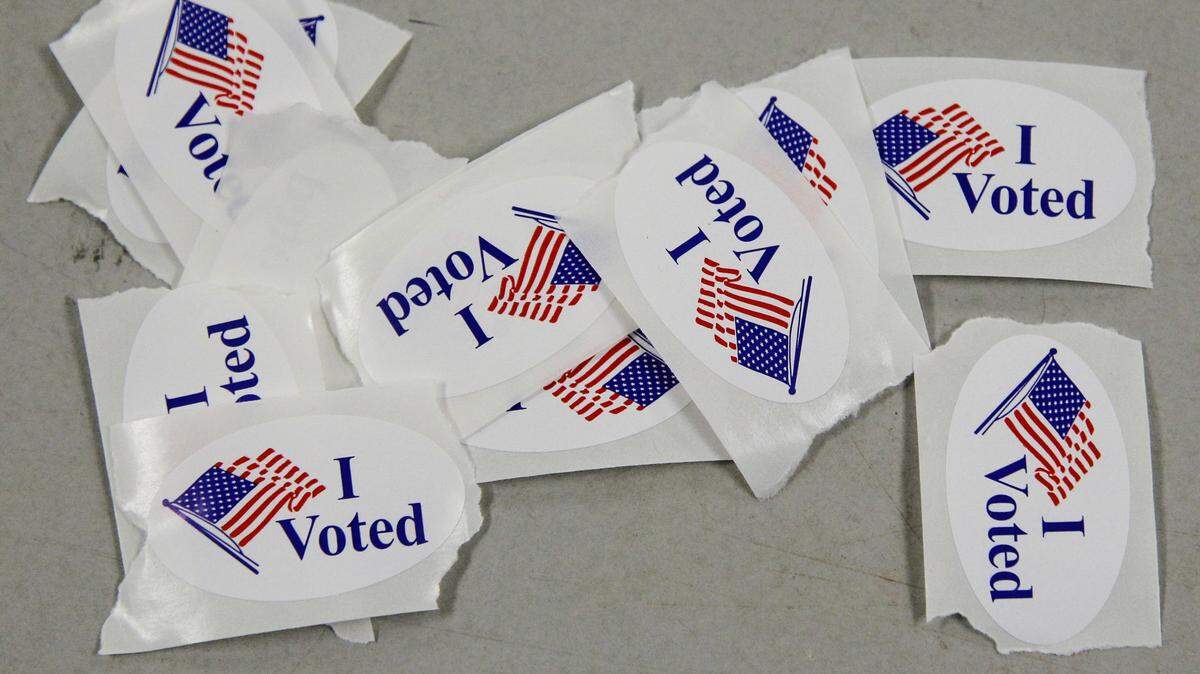 Voters get a sticker to encourage others to vote at voting precinct 2033 in the Tarrant County Sub-Courthouse in Mansfield, Texas, Tuesday, November 6, 2012. (Rodger Mallison/Fort Worth Star-Telegram/MCT)