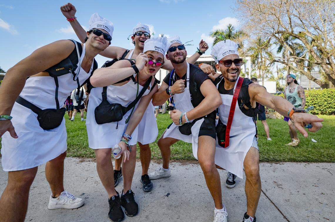 Wearing, “Don’t Mess With the Chef” hats, Miami Chefs Carson Chambers, Michael Kaufman, Ollie Zigel, Tony Gutierrez, seen left to right, and Gavin in the back pose for photographs during Ultra Music Festival in Miami, Florida, on Friday, March 27, 2026.