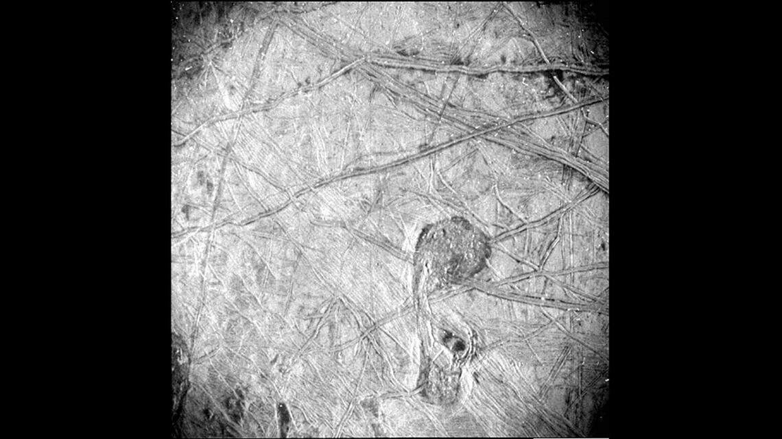 New high-resolution photos of Jupiter’s icy moon Europa show the surface is covered with something resembling roads rather than craters, and they go on for miles.
