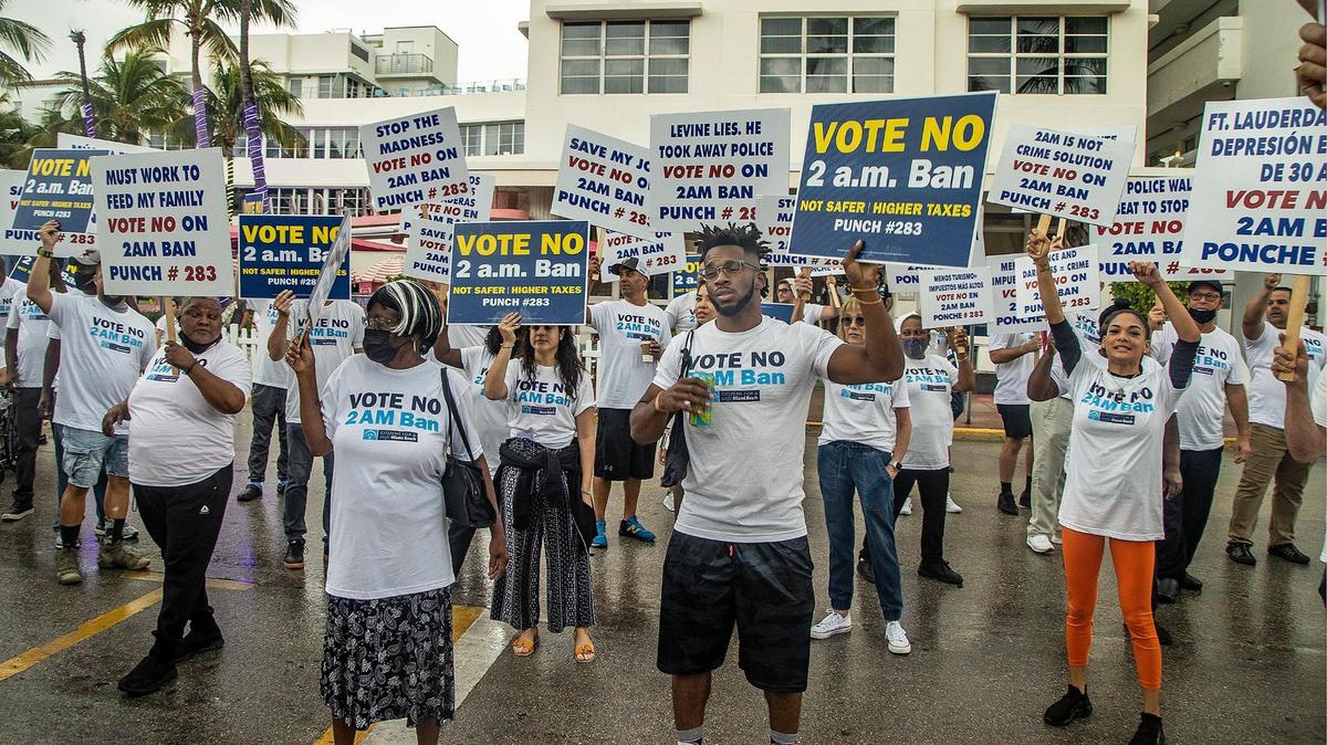 Protesters gather in South Beach ahead of a press conference held by Miami Beach Mayor Dan Gelber and former Mayor Philip Levine days before Election Day.