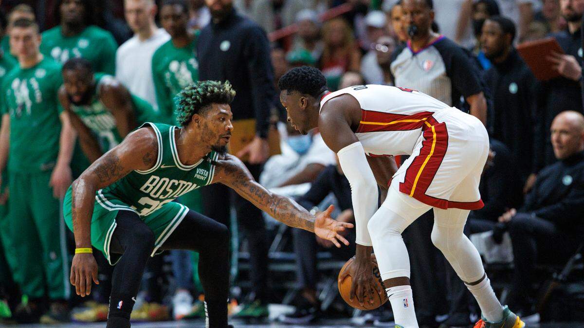 Miami Heat guard Victor Oladipo (4) drives against Boston Celtics guard Marcus Smart (36) during the first quarter of Game 7 of the NBA Eastern Conference Finals series at FTX Arena in Miami, Florida, on Sunday, May 29, 2022.
