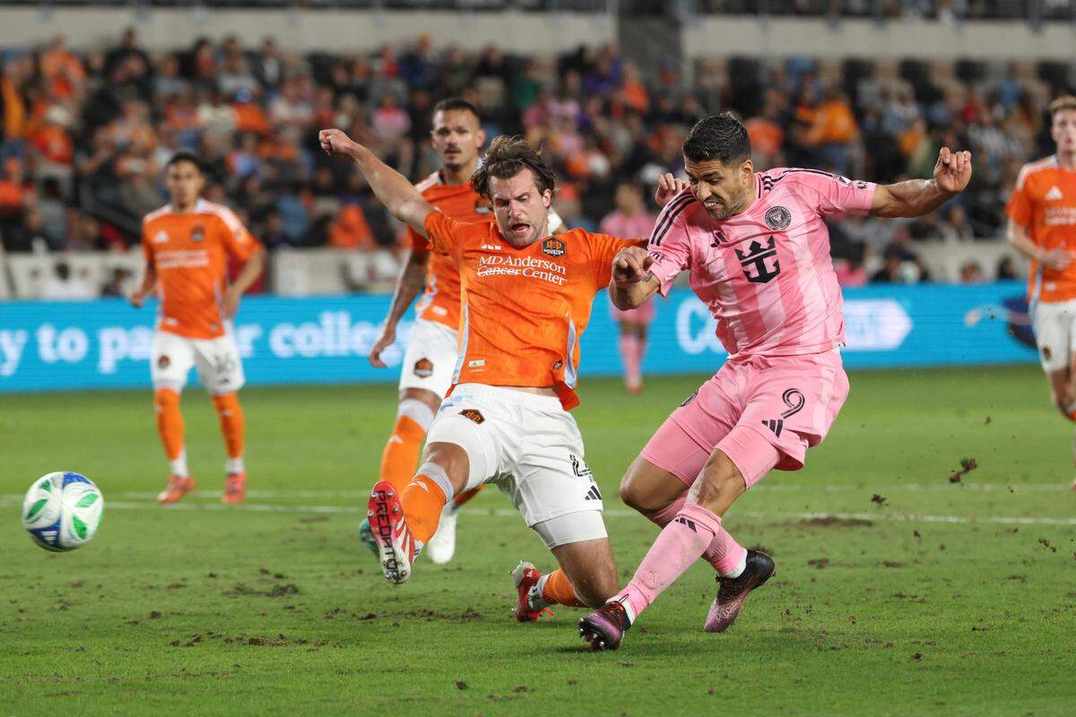 Mar 2, 2025; Houston, Texas, USA; Inter Miami CF forward Luis Suarez (9) scores a goal past Houston Dynamo FC defender Ethan Bartlow (4) during the second half at Shell Energy Stadium. Mandatory Credit: Troy Taormina-Imagn Images